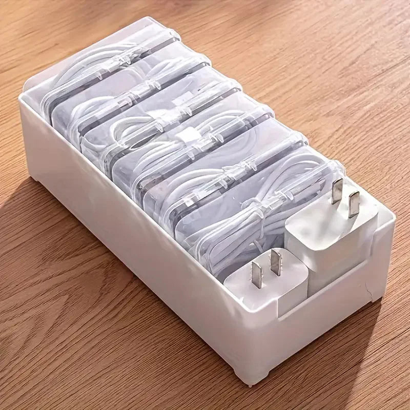 Top view of the stackable cable organizer tray with clear boxes filled with cords and adapters