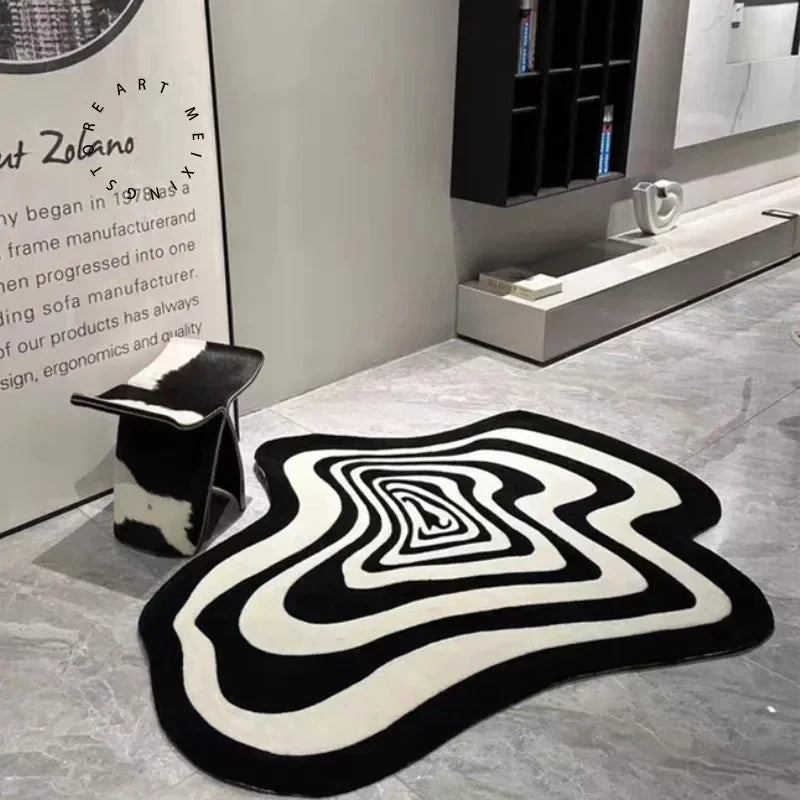 Irregular abstract rug in black and white pattern on marble tile floor