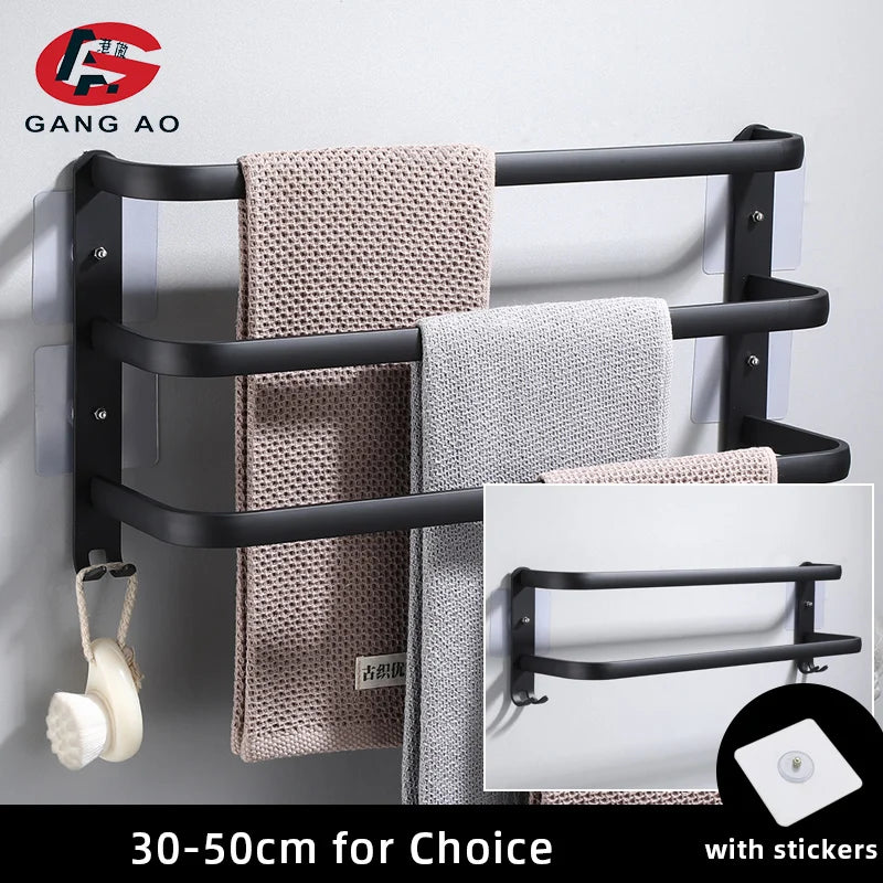 matte black wall-mounted towel rack holding two towels with hooks for accessories, adhesive sticker detail