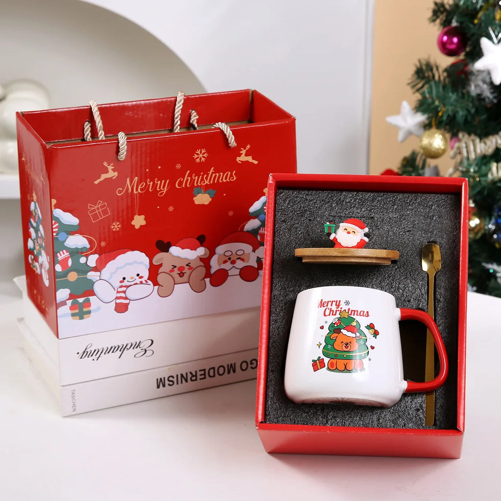 Ceramic Christmas mug set in a red gift box, including mug, lid with Santa figurine, and a gold spoon