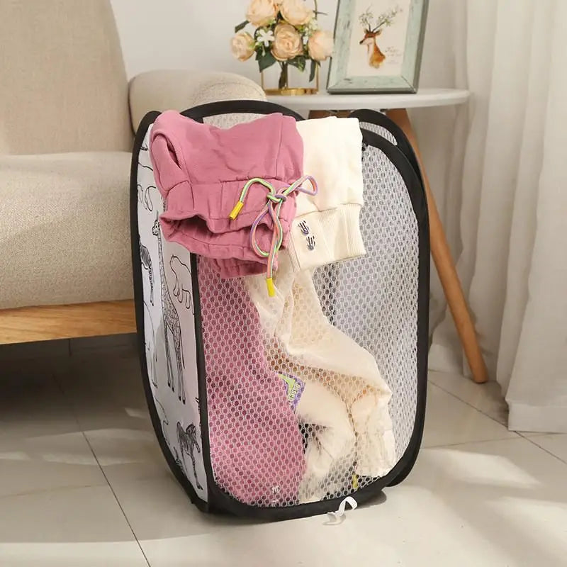 Black trim animal print mesh laundry basket partly filled with laundry in a child’s bedroom.