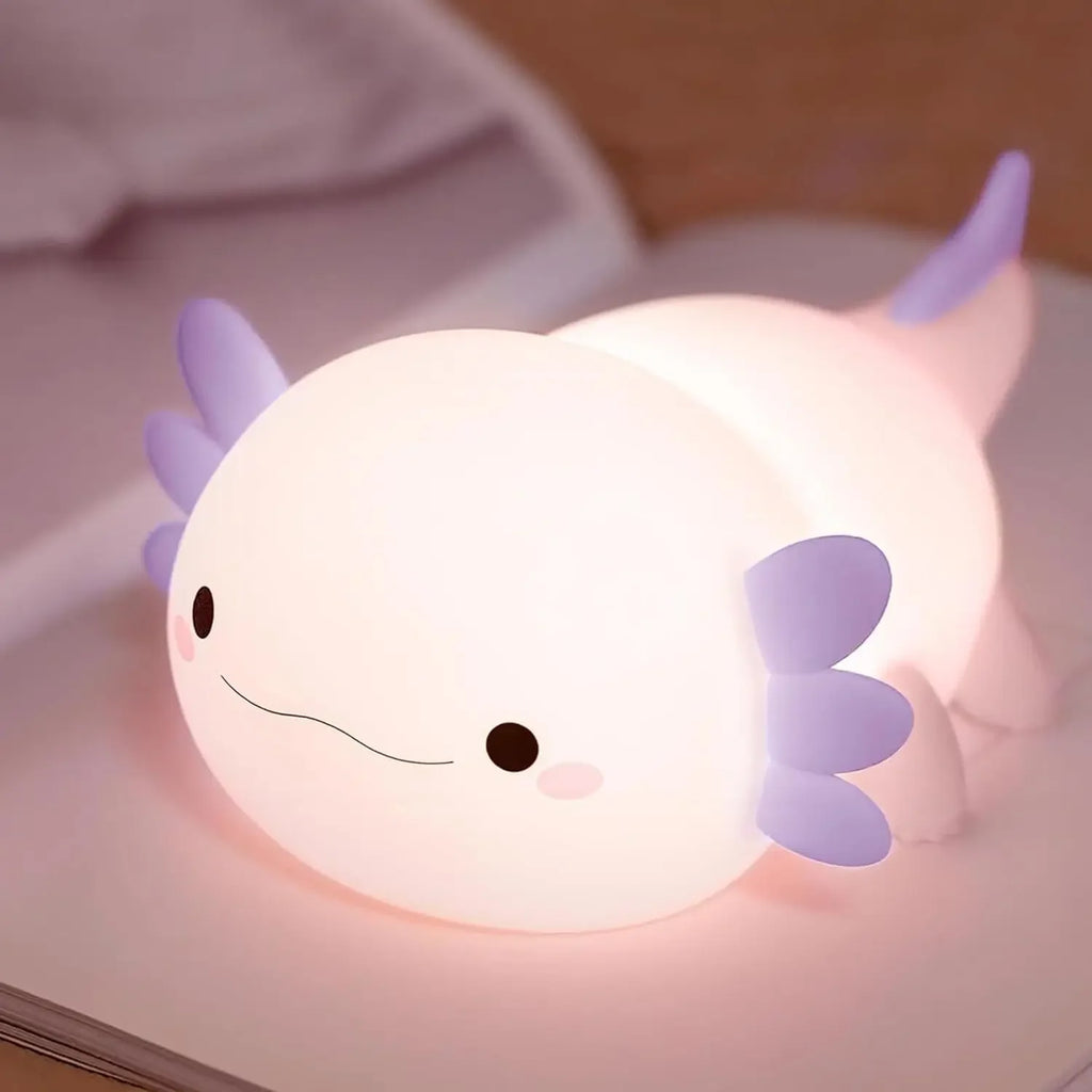 Axolotl silicone night light glowing softly on a child's nightstand