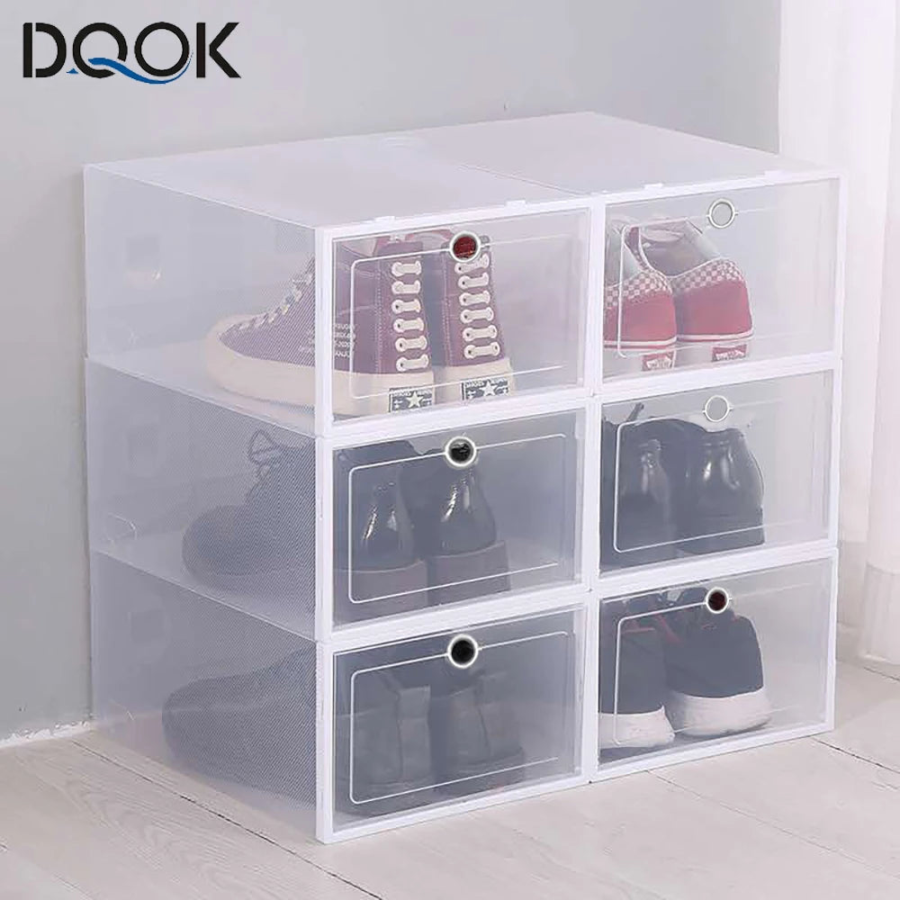 Set of six transparent shoe storage boxes stacked in a corner entryway, with different shoes inside