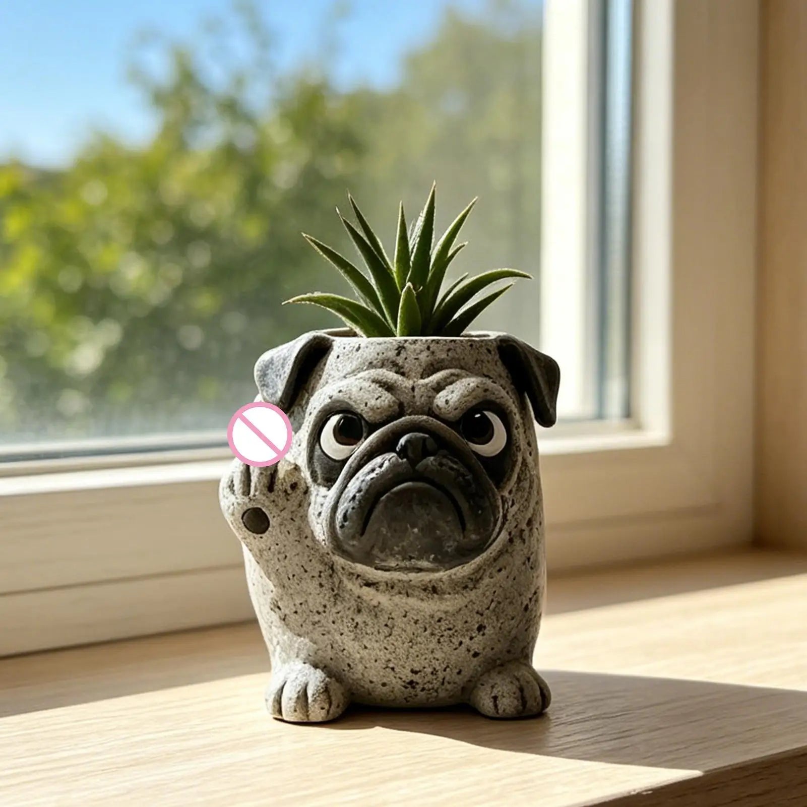dog shaped animal planter with succulent on a windowsill