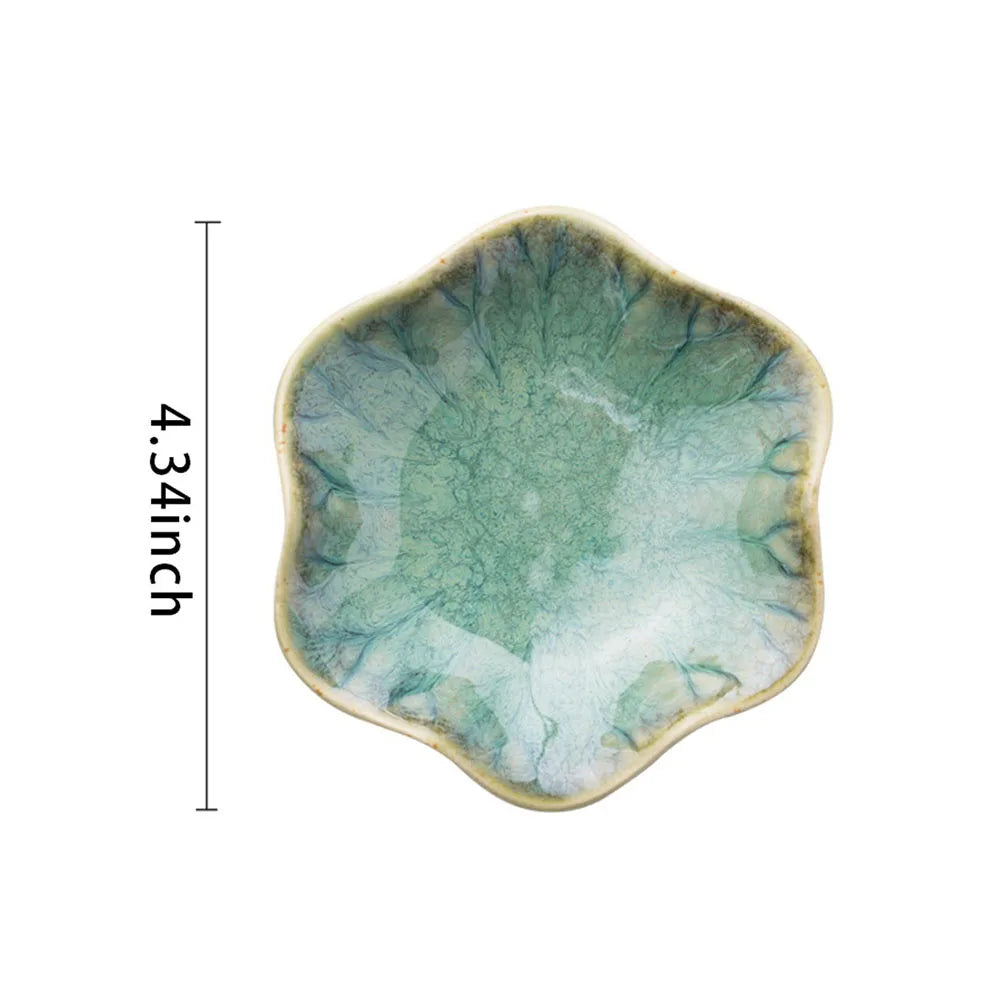 Lake green ceramic petal jewelry tray shown from above with a size measurement of 4.34 inches
