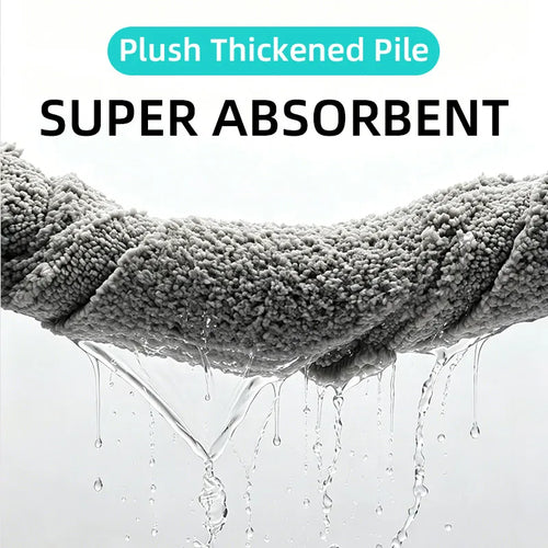 Close-up of thick, plush gray doormat being wrung out and displaying its absorbency