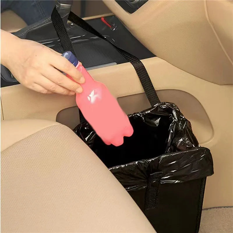 person placing a plastic bottle in black hanging car trash can by front passenger seat