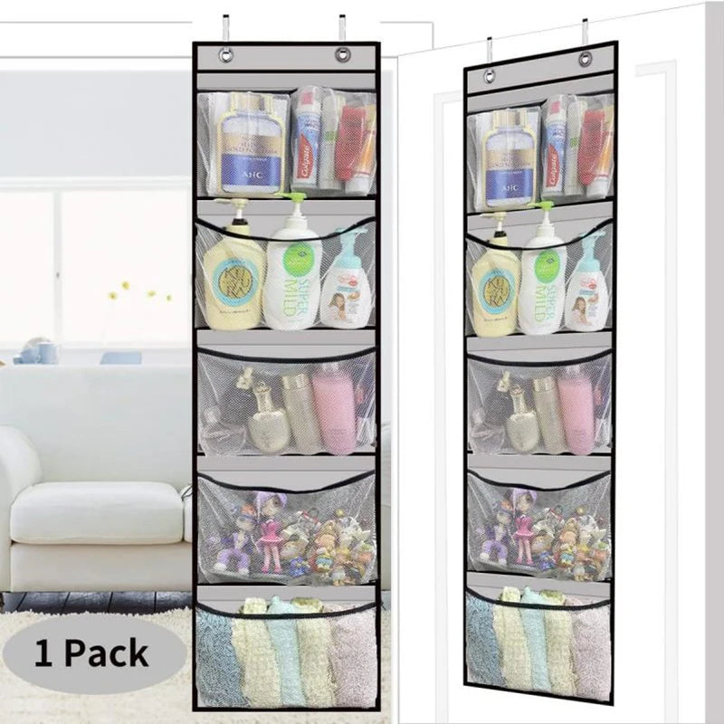 Grey over-the-door organizer with 5 mesh pockets shown hanging on a white door, filled with bottles, towels, and toys