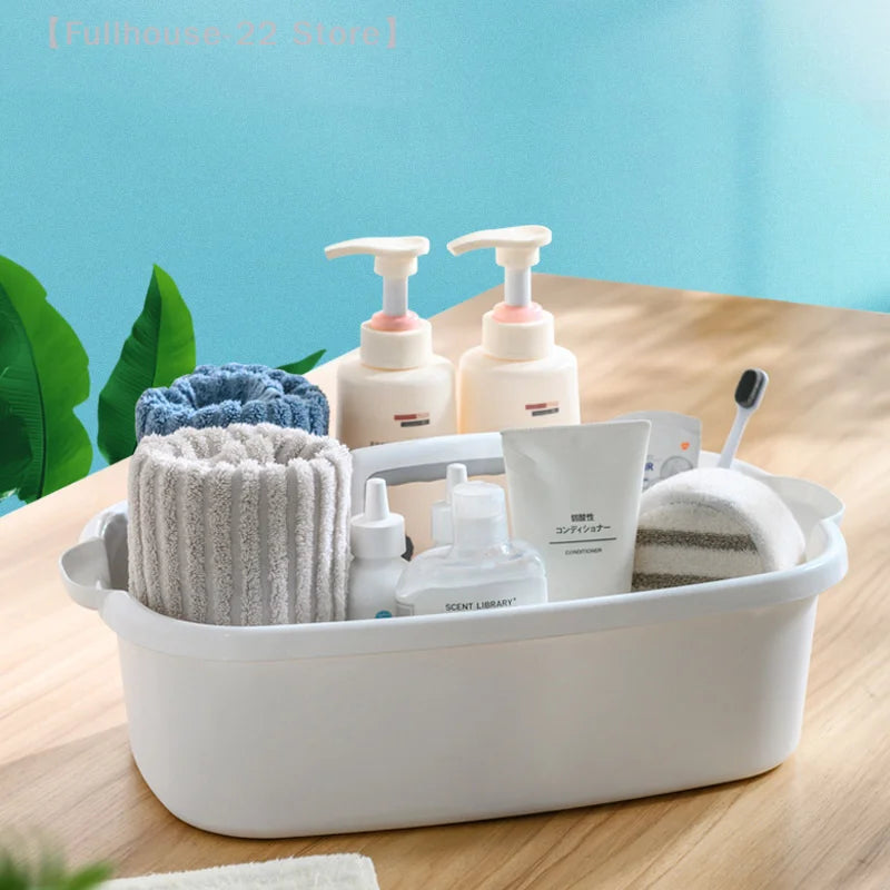 White handled caddy holding towels and pump bottles in bath setting