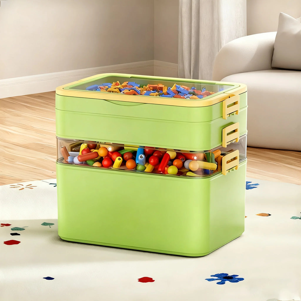 Two-layered green stackable storage box, filled with small toys, placed on a playroom rug