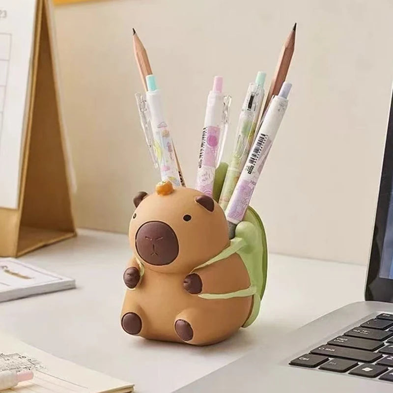 Resin animal pen holder on a home office desk with pens and pencils