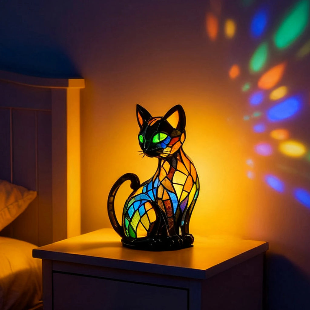 Colorful cat shaped LED night light casting warm glow on wall