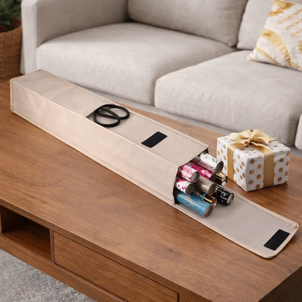 Beige wrapping paper storage bag on a wooden table, showing gift wrap rolls and black scissors in the pocket.