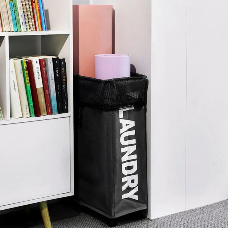 black slim rolling laundry hamper holding yoga mats and fitting next to bookshelf