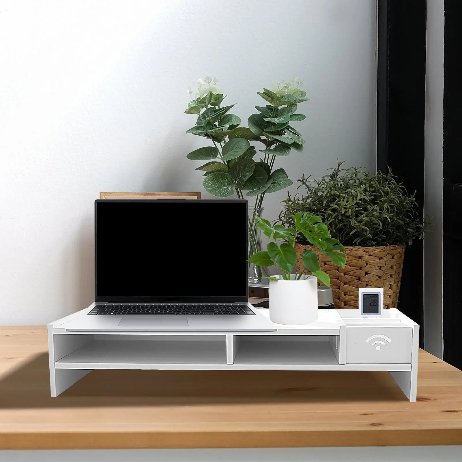 white desk organizer shelf in home office setup with laptop and potted plants