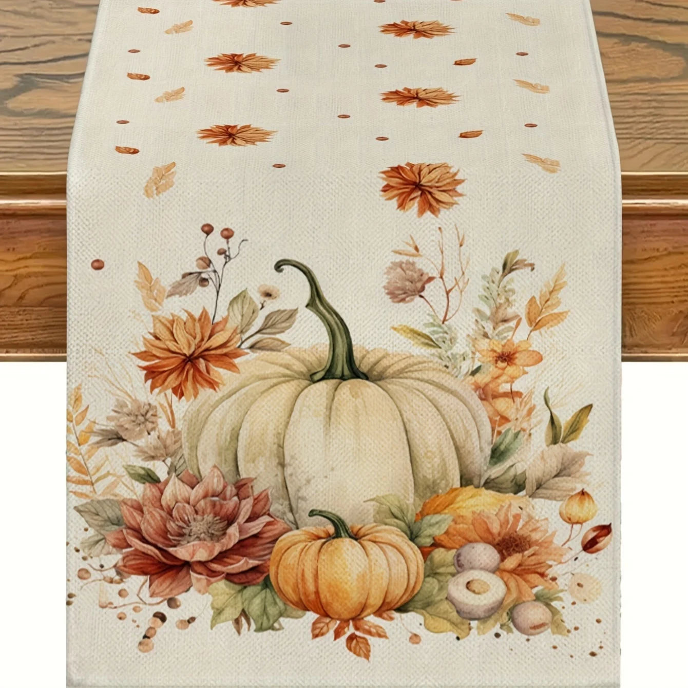 white pumpkin table runner with dahlias and fall accents displayed