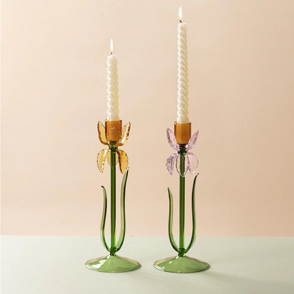 Both glass iris flower candle holders with spiral taper candles lit