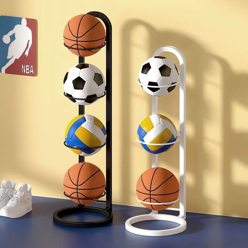 Two freestanding multi-layer ball storage racks in black and white, each holding basketballs, a soccer ball, and a volleyball, shown in a modern entryway setting.