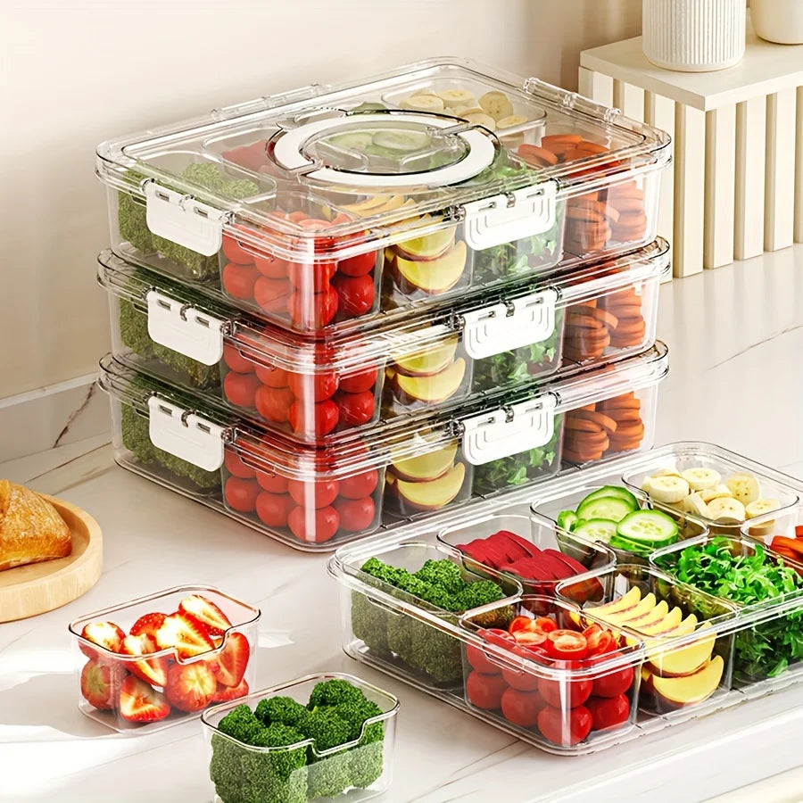 Stacked clear divided serving trays with lid, filled with assorted cut fruits and vegetables for fridge storage