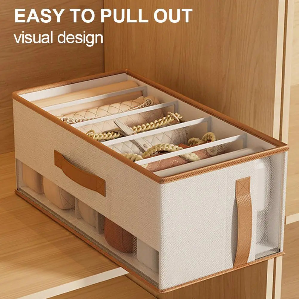 Foldable purse organizer with mesh window and pull-out handle, shown with accessories