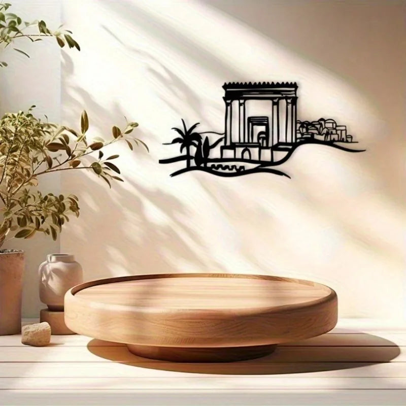 modern geometric cityscape metal wall art next to a plant and wooden tray