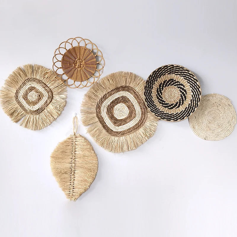 Assorted handwoven raffia wall hangings in neutral and natural tones
