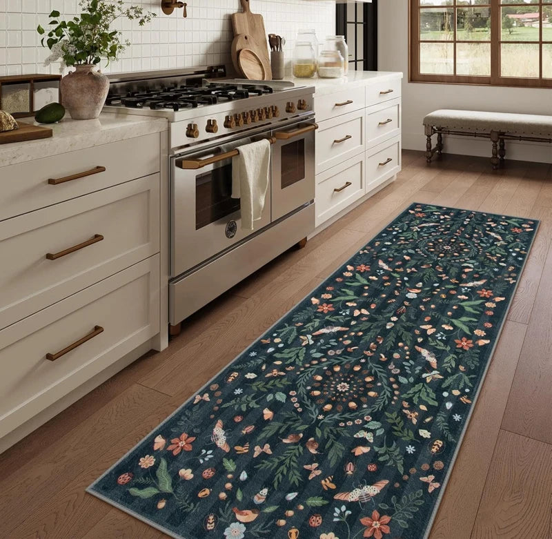 blue floral runner rug in a white kitchen with a stove and wooden floor
