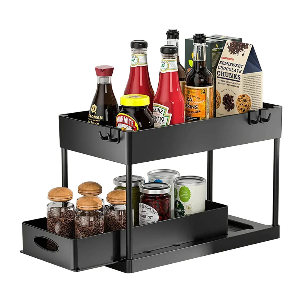 Sliding under sink organizer holding condiments and jars on kitchen counter