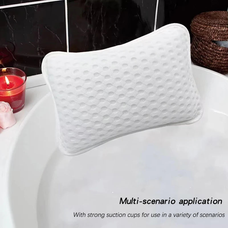 White mesh bath pillow attached to a tub by suction cups, candle and wicker basket in the background