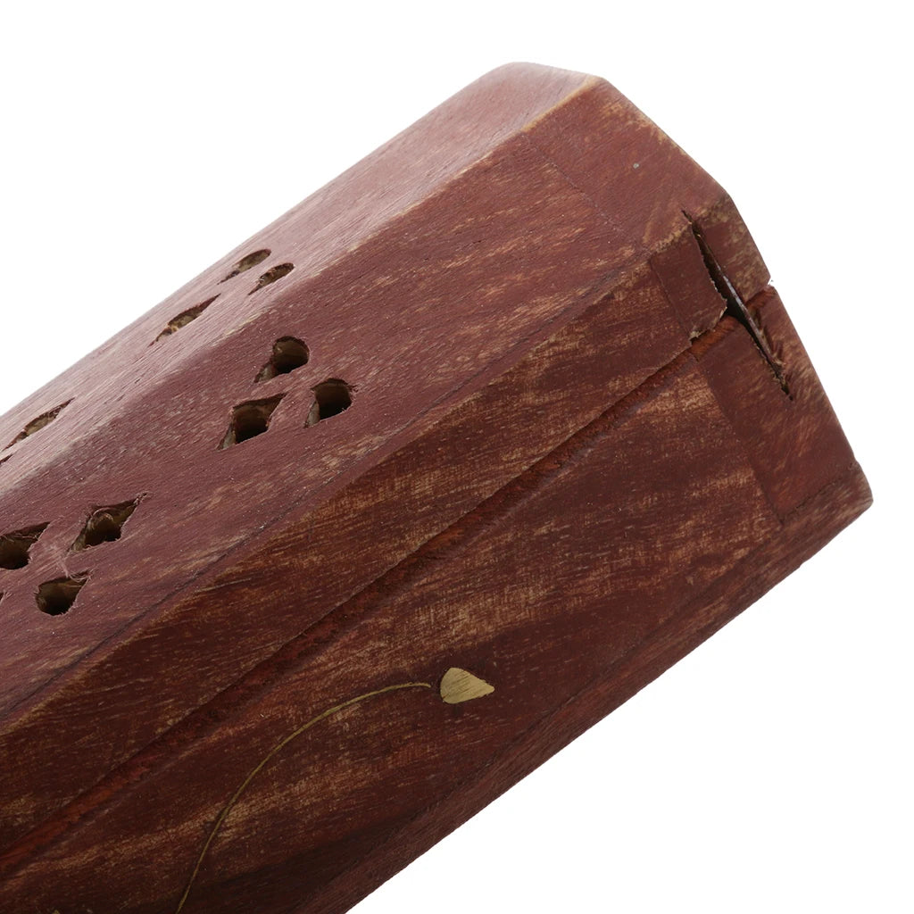 Corner closeup of incense box, showing wood grain and small brass inlay