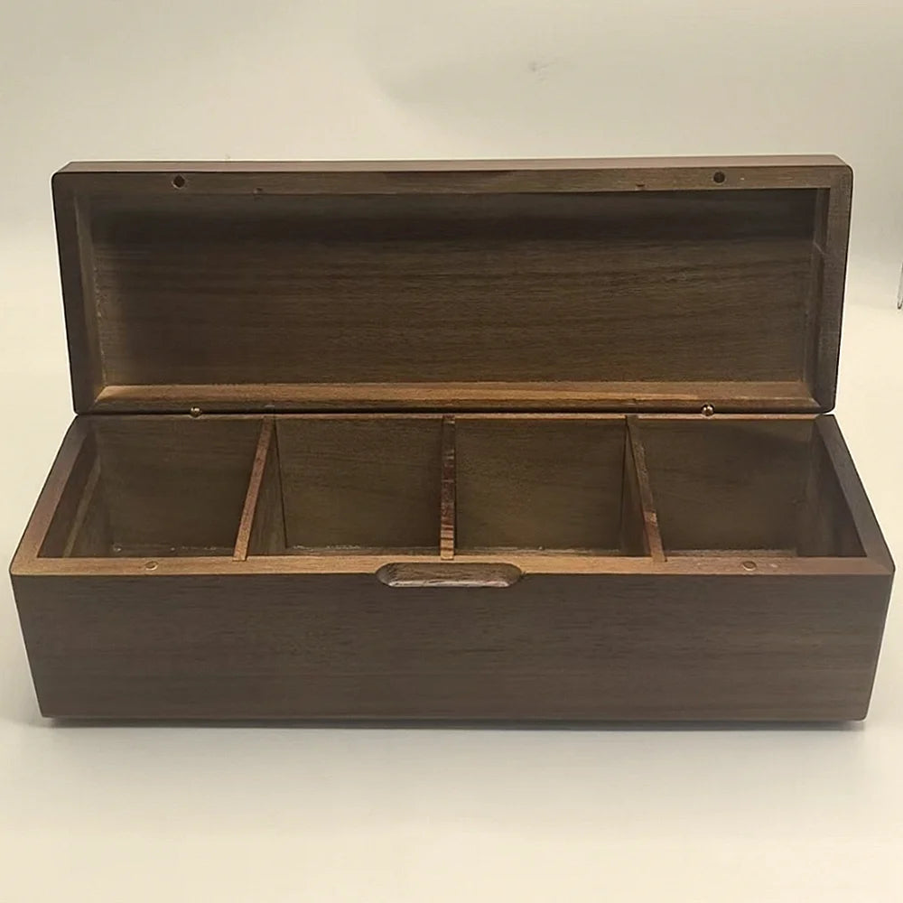 Empty acacia wood tea storage box with 4 compartments, lid open on a plain background