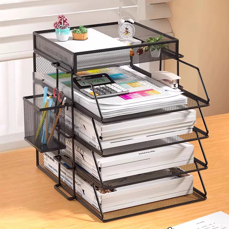 Black mesh desk organizer with four trays and pen holder on a home office desk