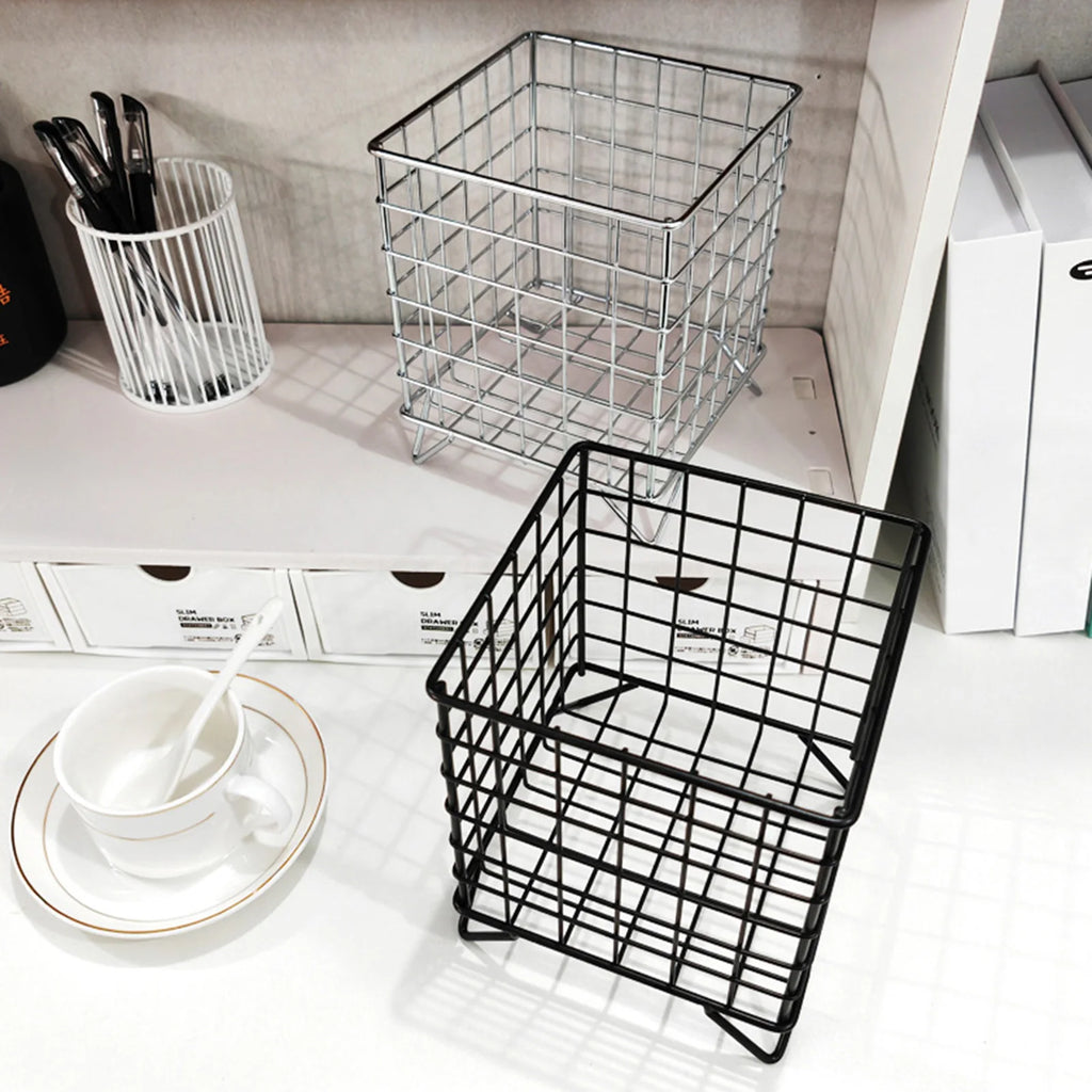 black and silver metal wire storage baskets on a shelf with cup and utensils nearby