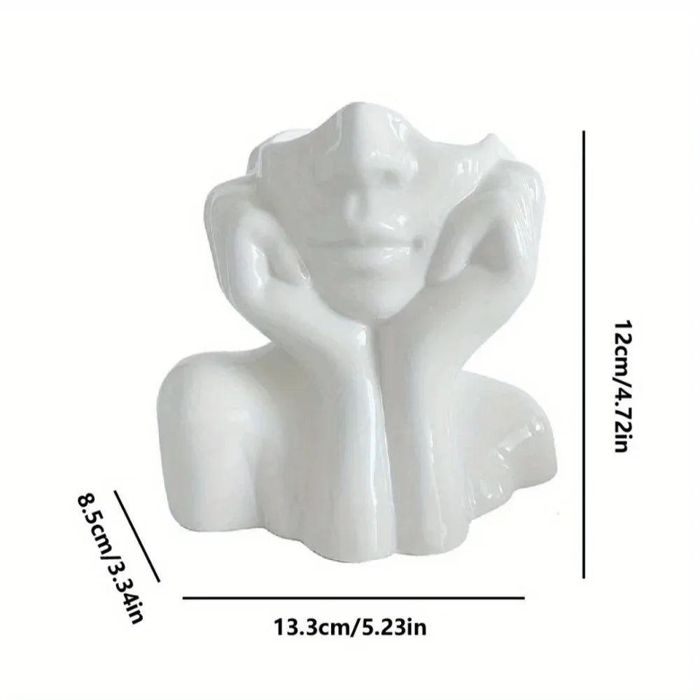 White face sculpture holder with measurements in centimeters and inches
