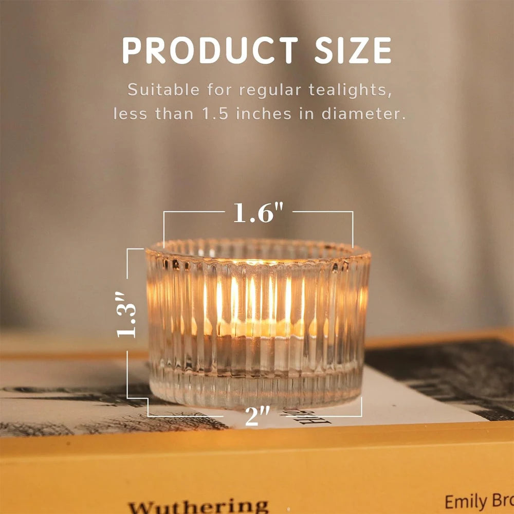 close-up of a clear ribbed glass tealight holder on a book, showing dimensions