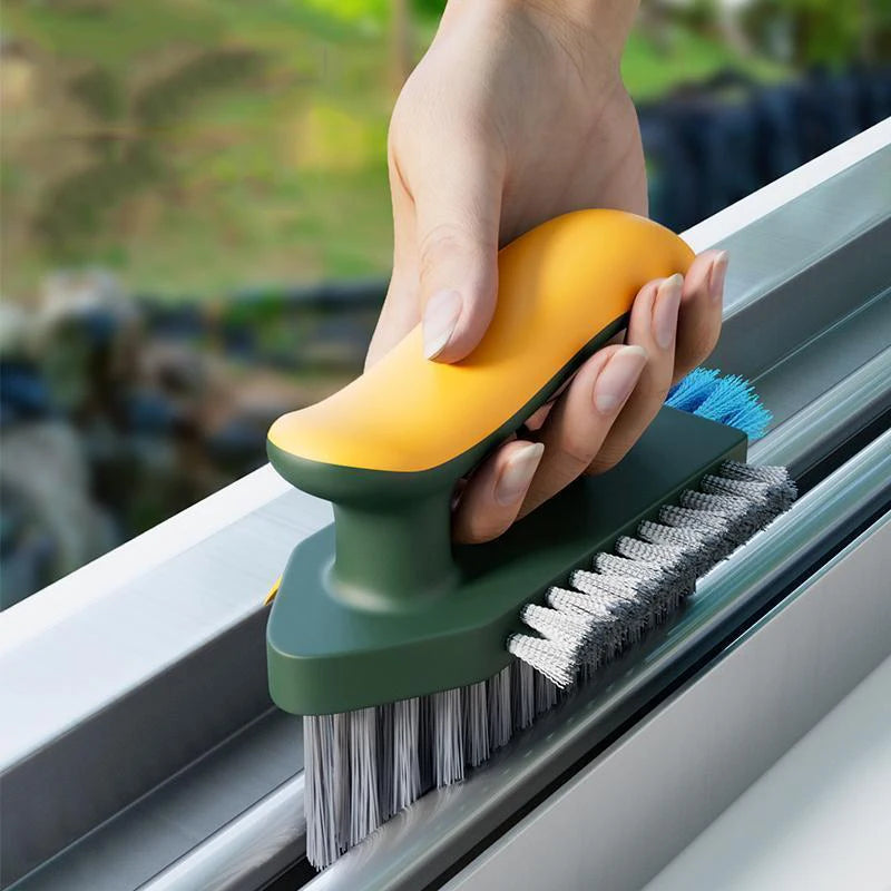 Yellow green cleaning brush scrubbing a window track crevice