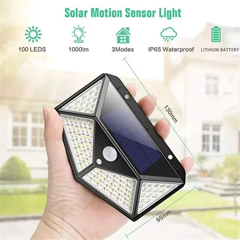 Compact black solar motion sensor wall light held in hand with dimensions visible