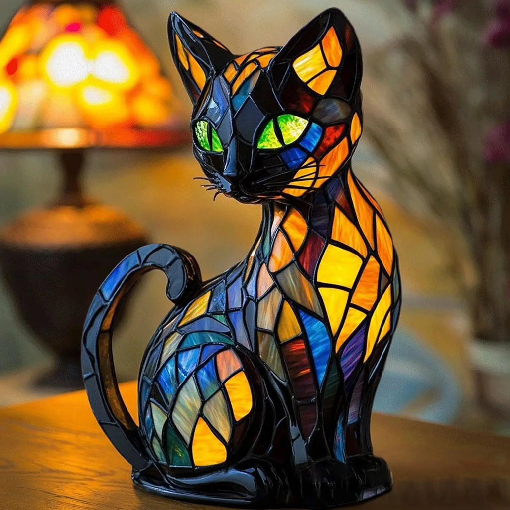 Closeup of resin cat nightstand lamp with stained glass style pattern