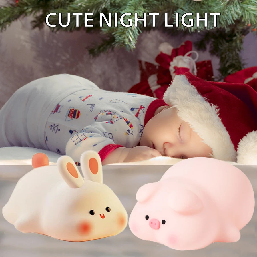 Bunny and piggy silicone animal night lights beside a sleeping child under a Christmas tree