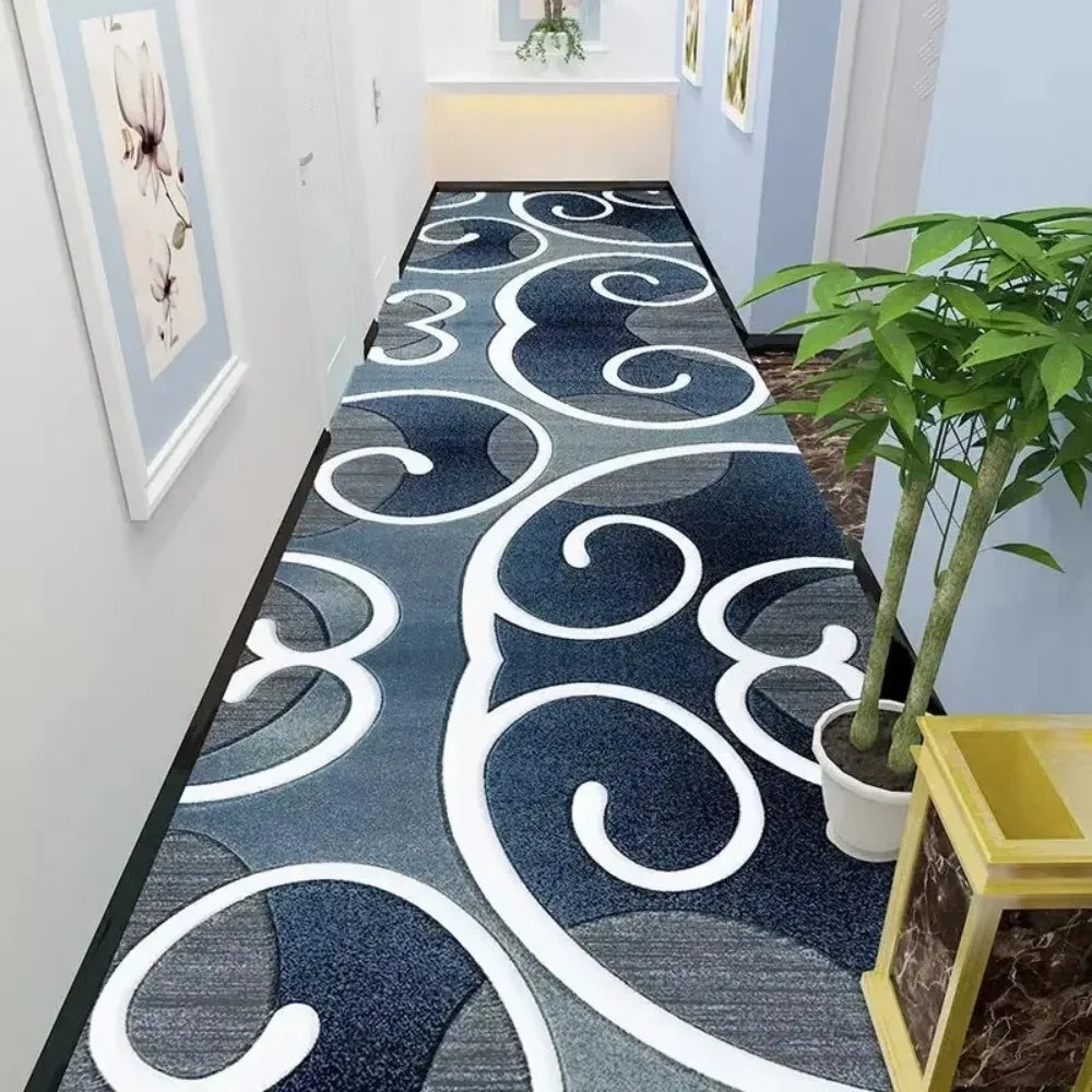 Blue and white abstract swirl pattern runner rug in a contemporary hallway