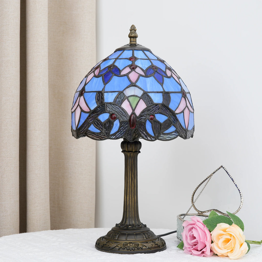 Blue stained glass table lamp on a side table in a living room setting