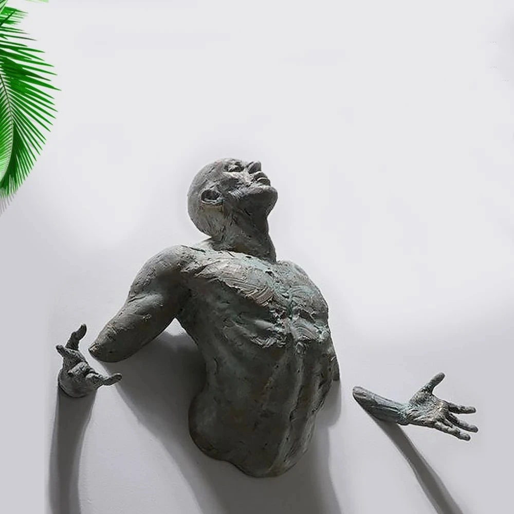 Abstract 3D man sculpture with arms outstretched, resin wall art in a modern setting