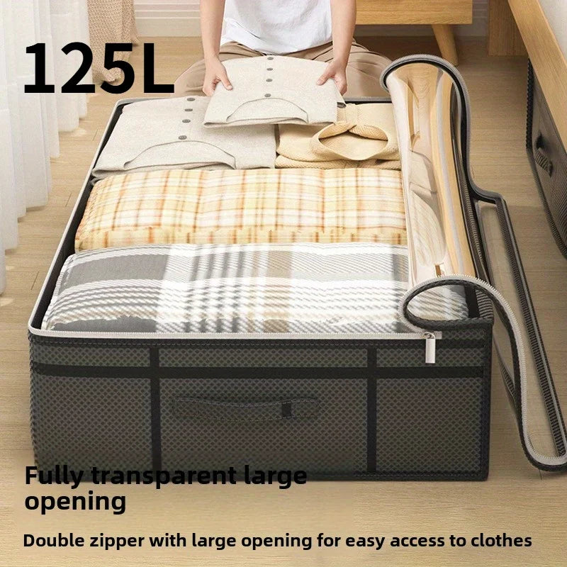 Large under-bed storage bin with clear window lid filled with bedding and clothes
