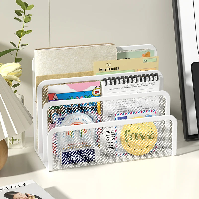 white mesh desk mail organizer with letters, papers, and planners on a desk