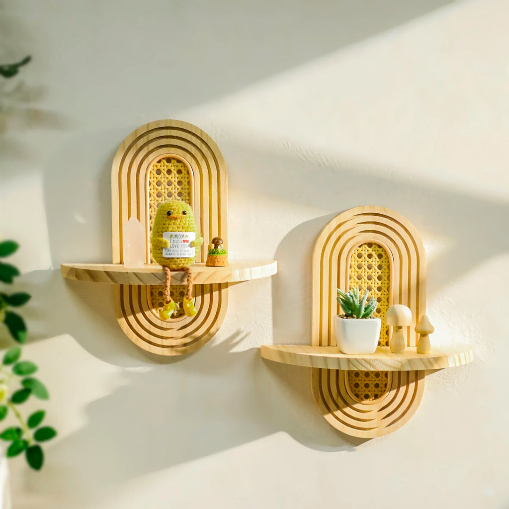 Two wooden arch wall shelves with rattan backs, shown with small decorative objects and soft natural light.