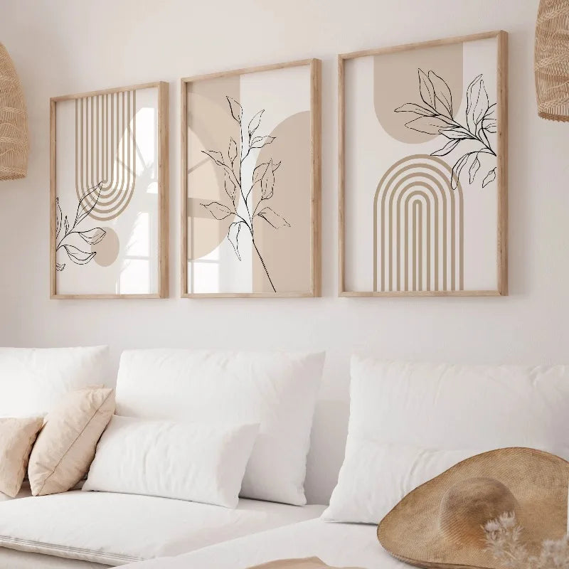 Beige botanical canvas art set displayed in a cozy white sofa nook with light-toned natural decor