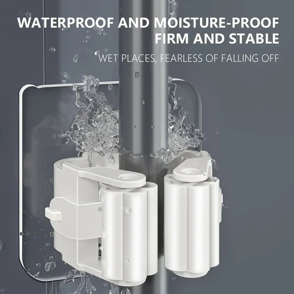 Grey mop holder shown installed on a wet wall with water splashing to indicate moisture resistance