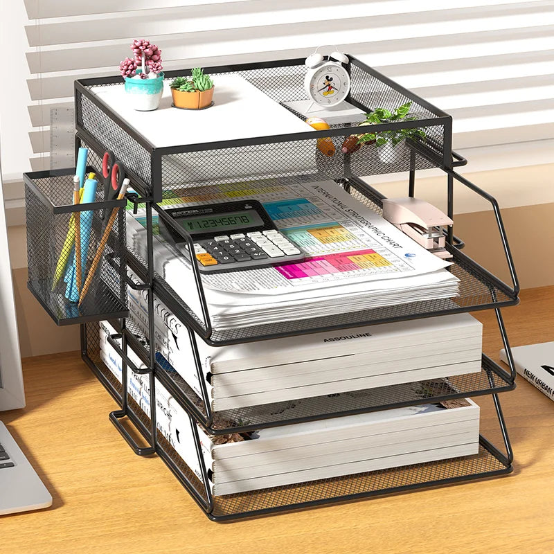 Black mesh metal desk organizer with three trays and side pen holder in a home office setting