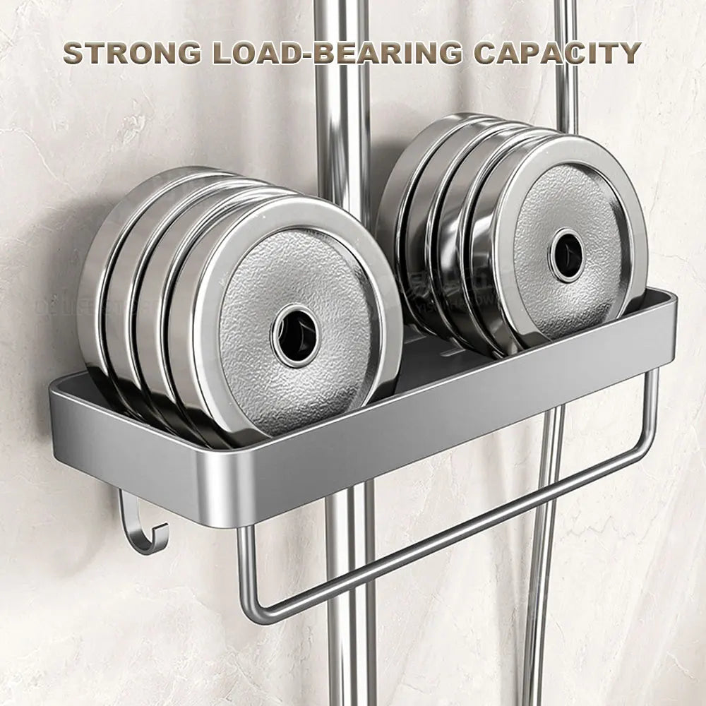 Gray shower caddy on a bathroom wall supporting several metal weight plates to show load capacity