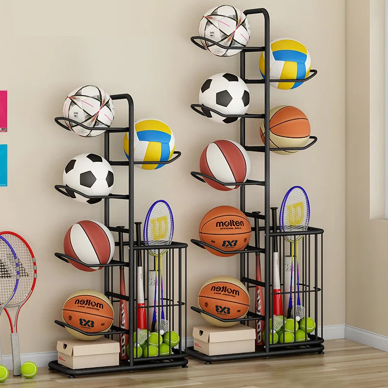 Two black freestanding sports equipment racks filled with various balls and rackets in a family game room